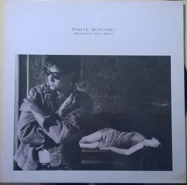 Paul Young ‎– Between Two Fires